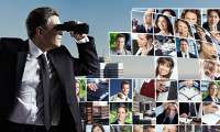 Businessman with binoculars.